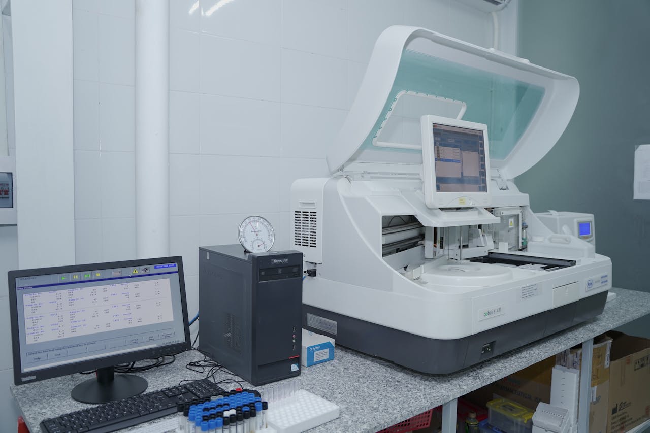 High-tech laboratory equipment with computer system in lab setting.